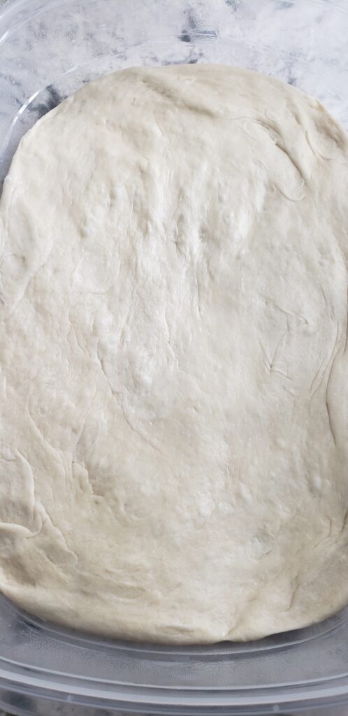 Press Bread dough down.